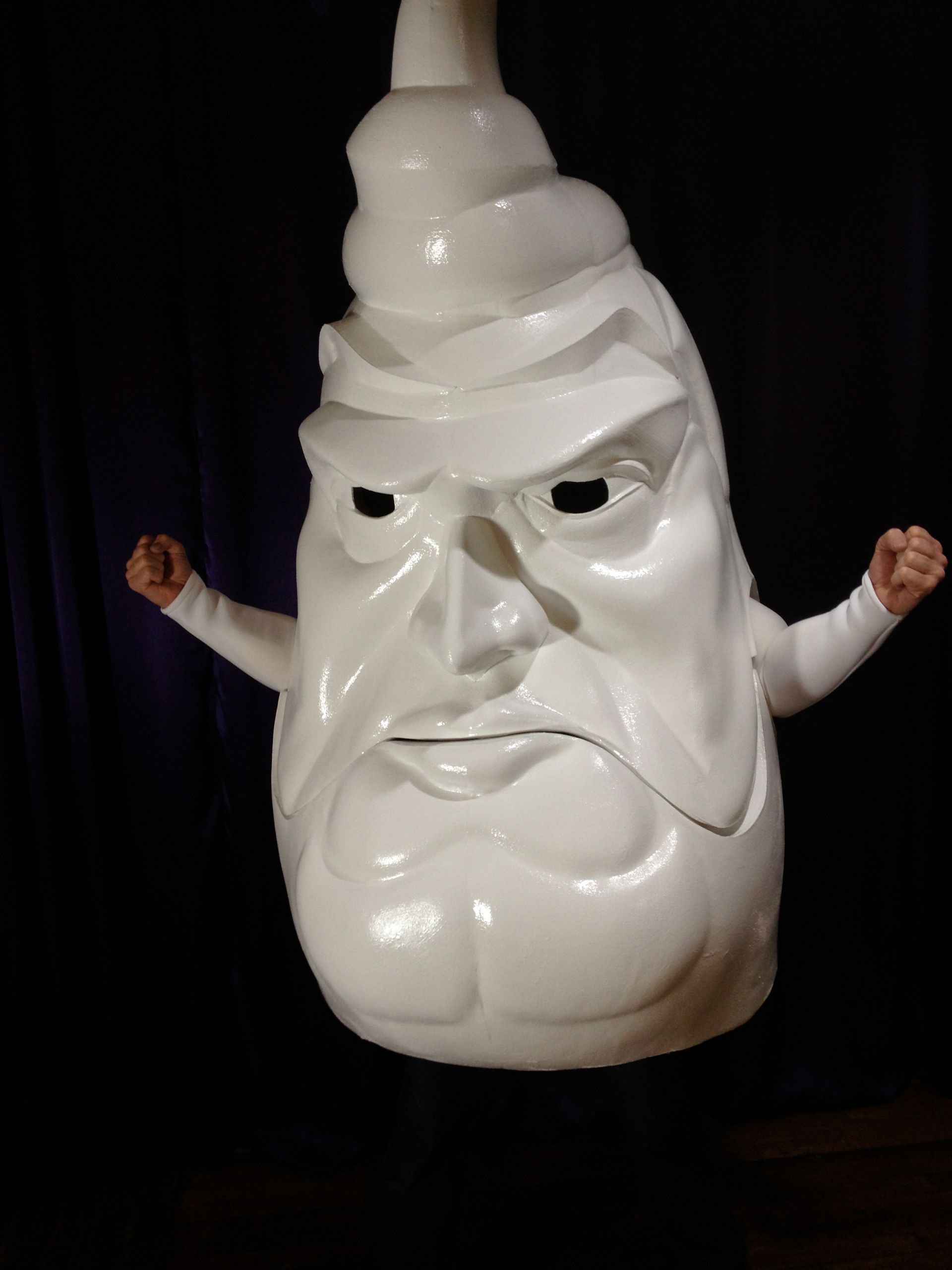 A white statue of a man with a beard and hat