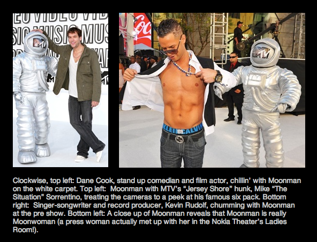 A man in a space suit is standing next to another man