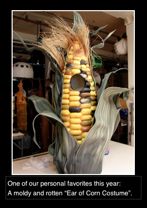 A picture of a corn on the cob with a birdhouse in it