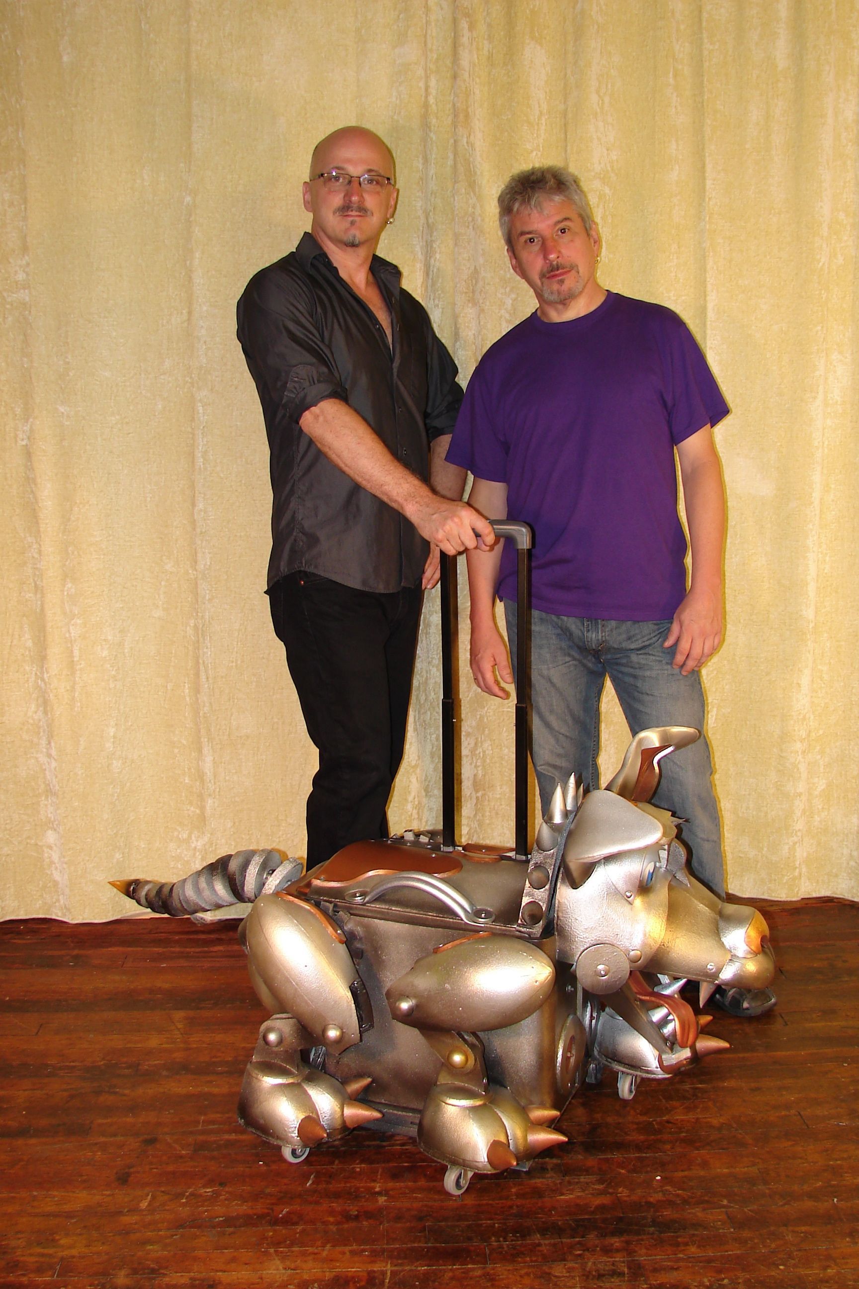 A man in a purple shirt is shaking hands with another man