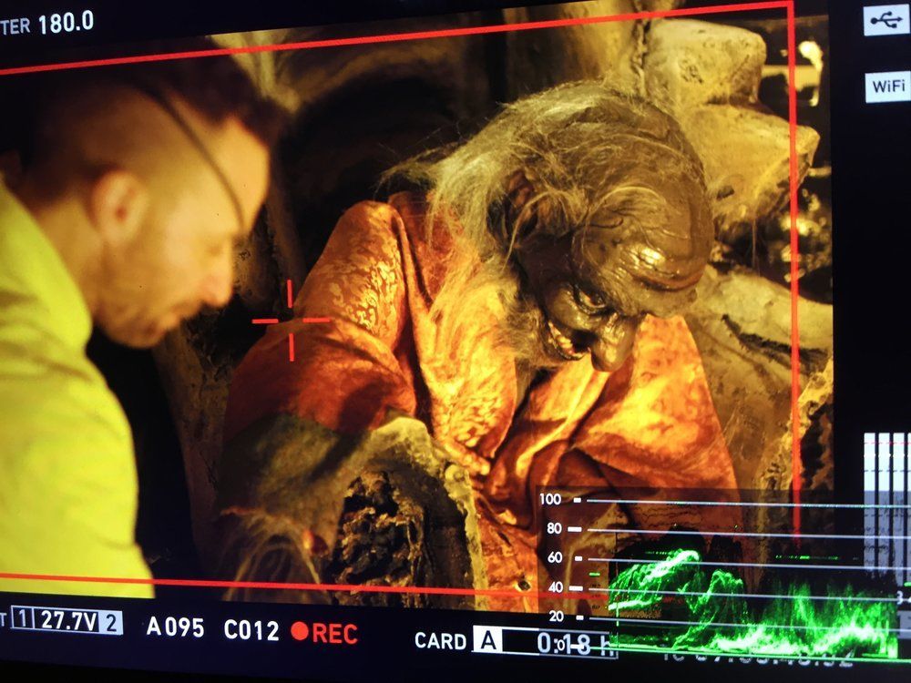 A man is looking at a screen that says card 4 on it