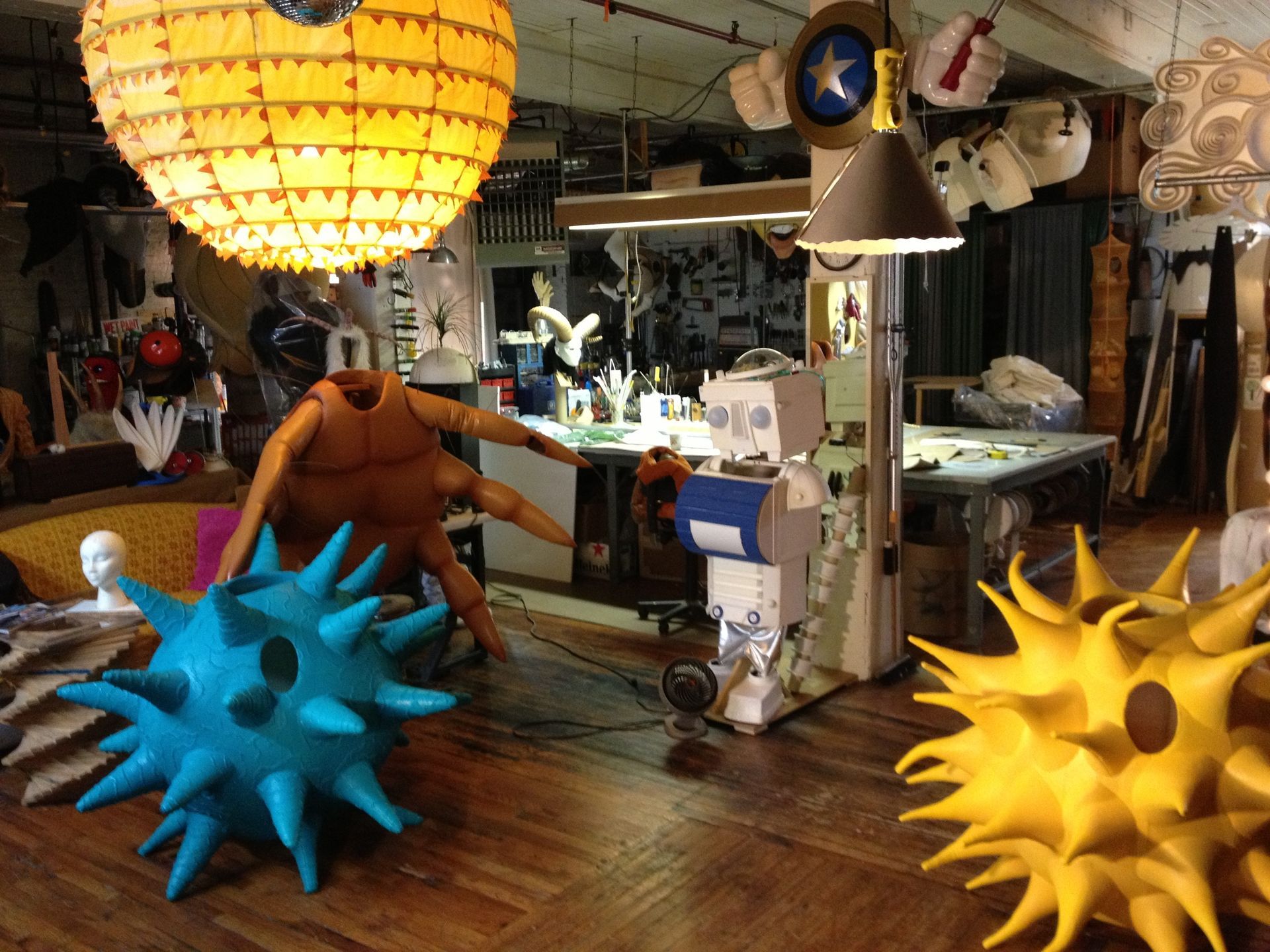 A room filled with lots of sculptures including one that looks like a spider