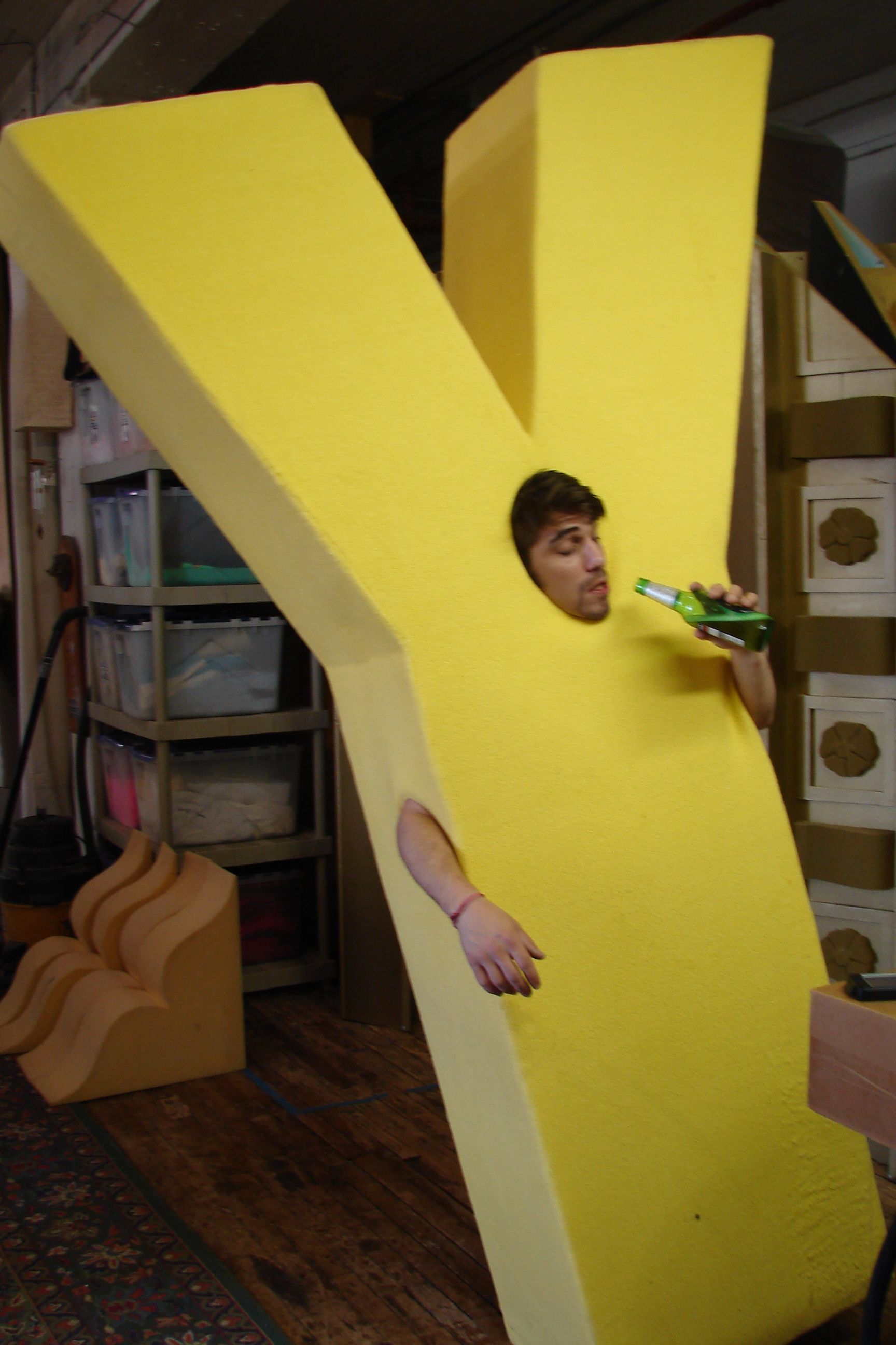 A man is dressed in a yellow letter y