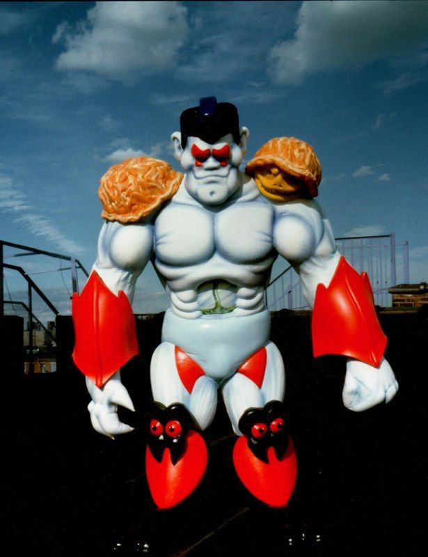 A statue of a man with a turtle on his shoulder