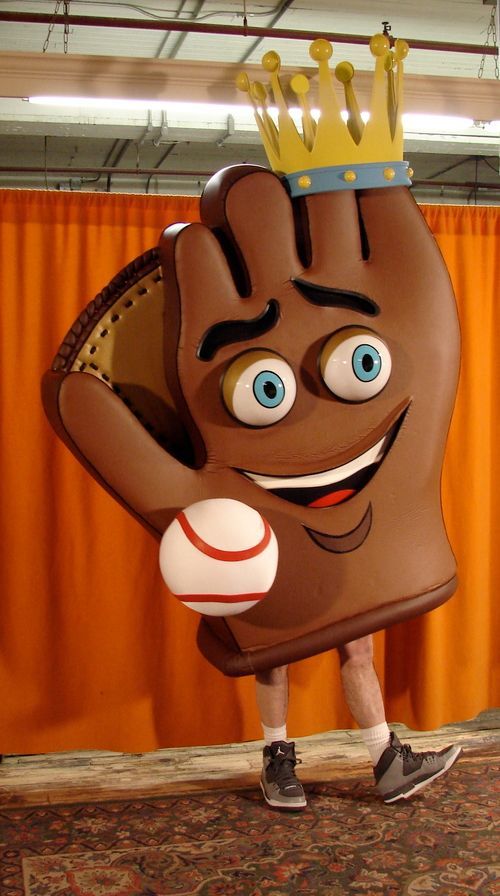 A cartoon glove is wearing a crown and holding a baseball.