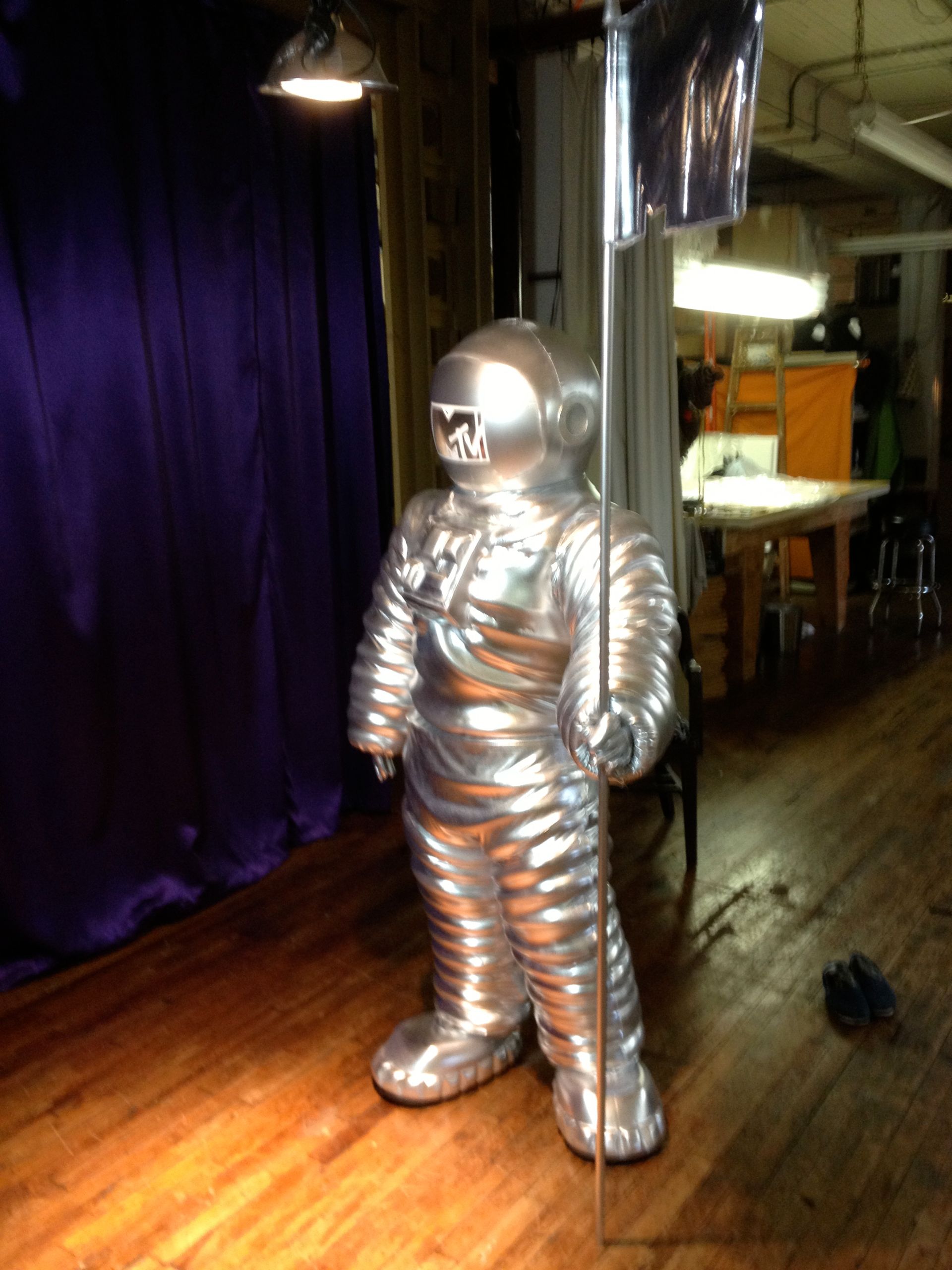 A statue of an astronaut with a mtv logo on his face