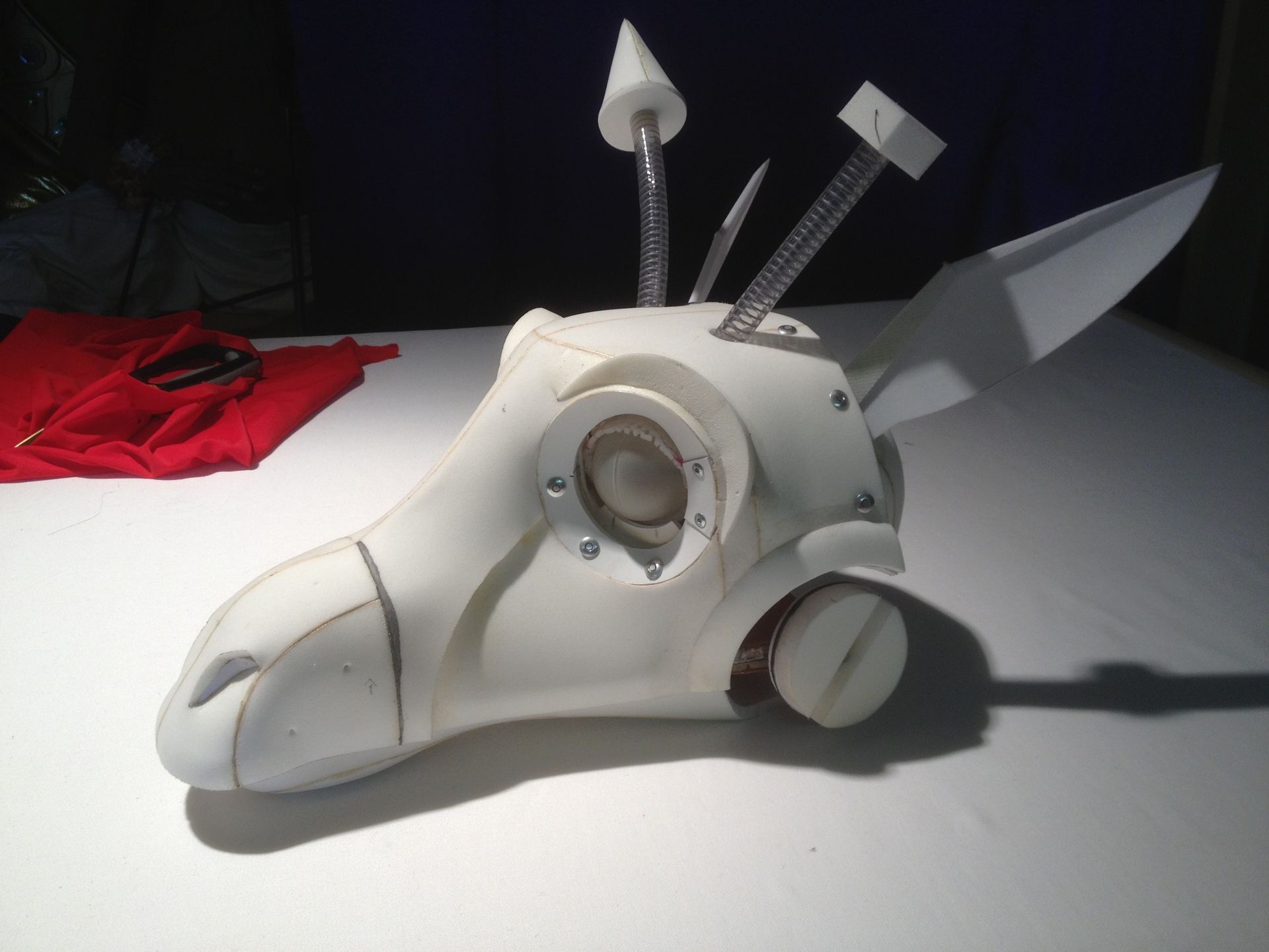 A white object with horns and a hammer on top of it