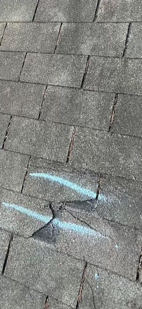 A close up of a brick floor with a hole in it.