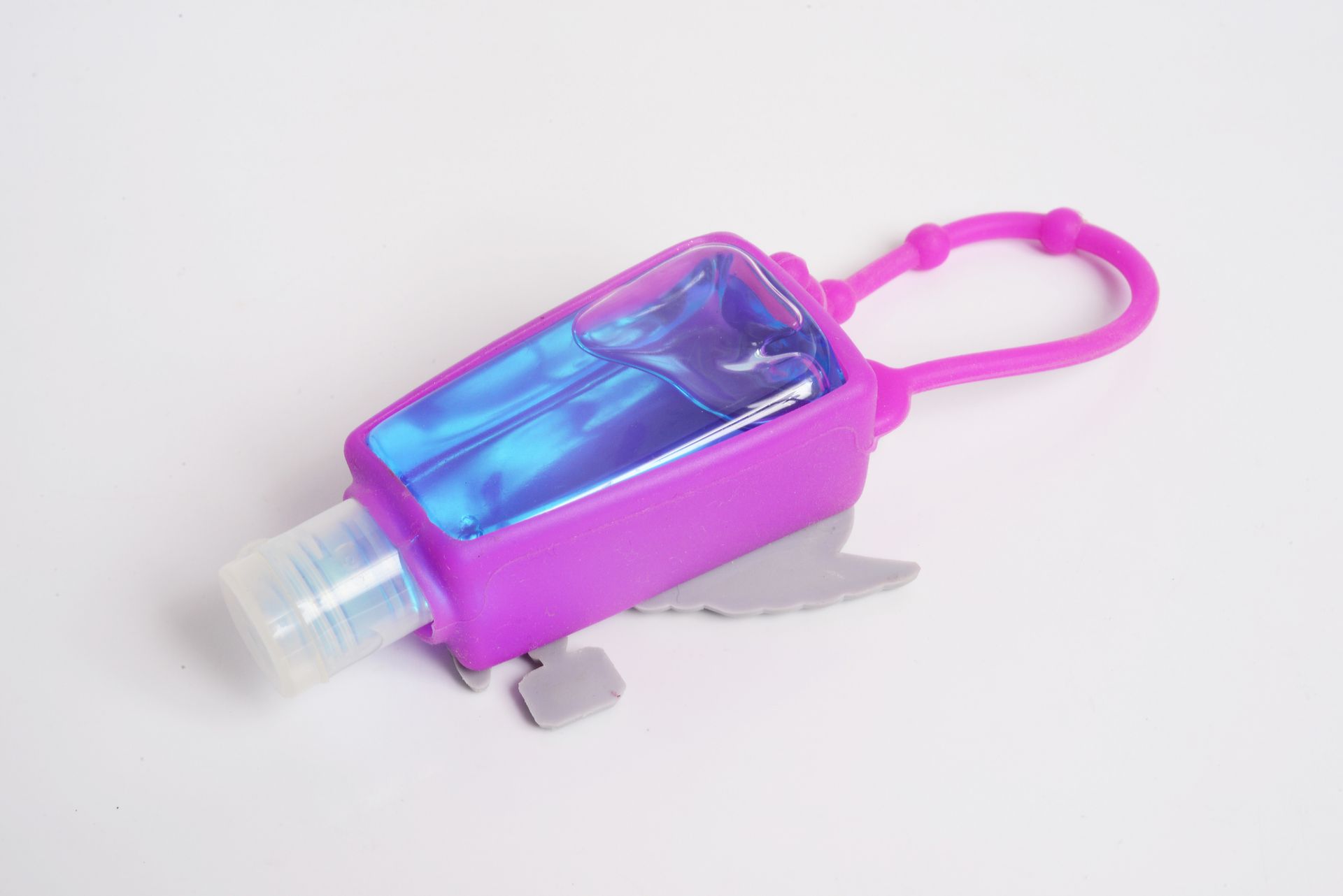 A bottle of hand sanitizer in a purple case on a white background.