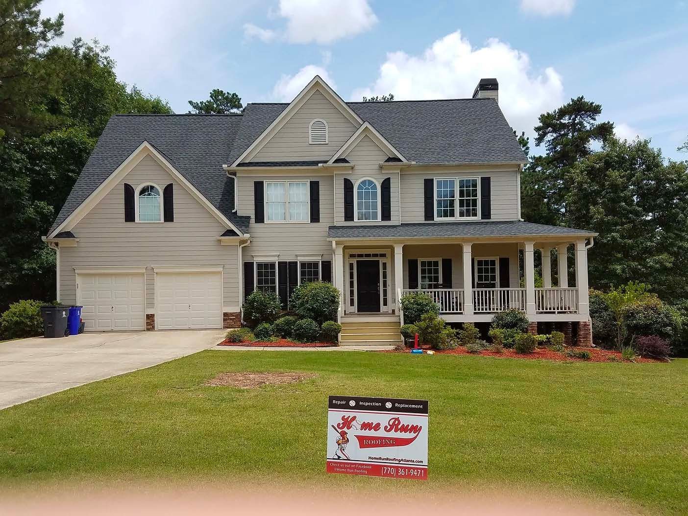 A large house with a sign in front of it that says home sweet home