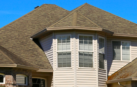 A house with a roof that has shingles on it
