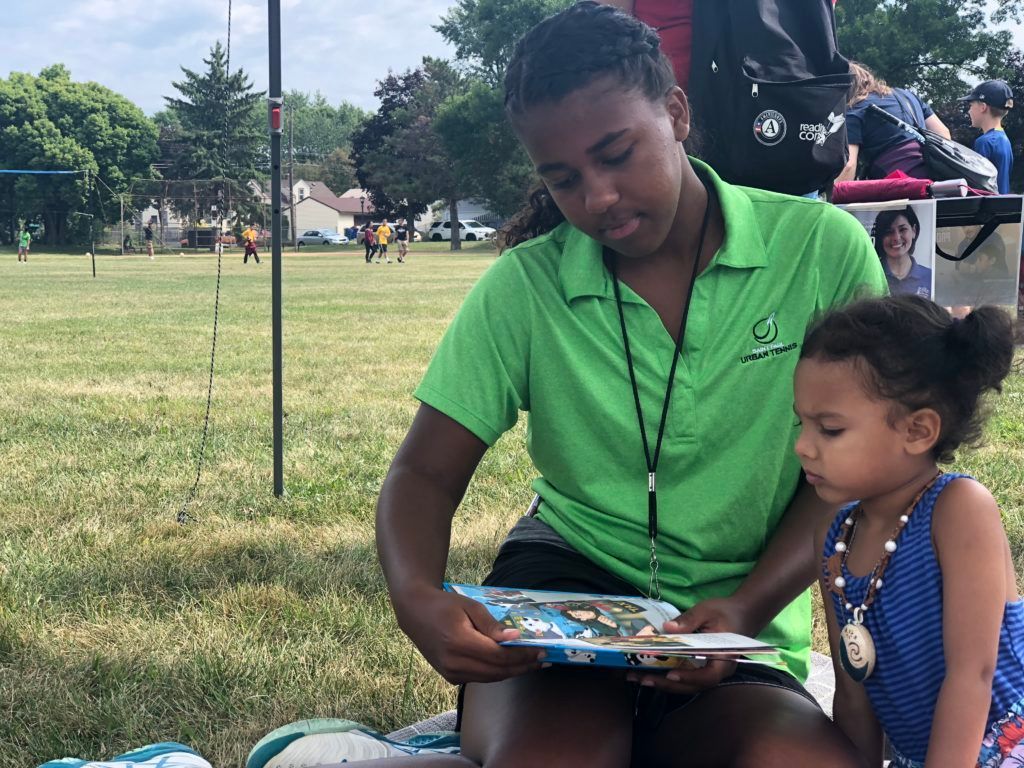 sput coach reading to a child