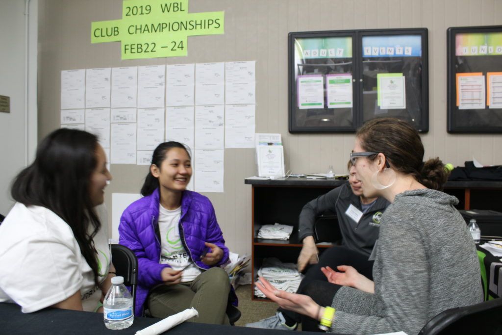 students discussing tennis