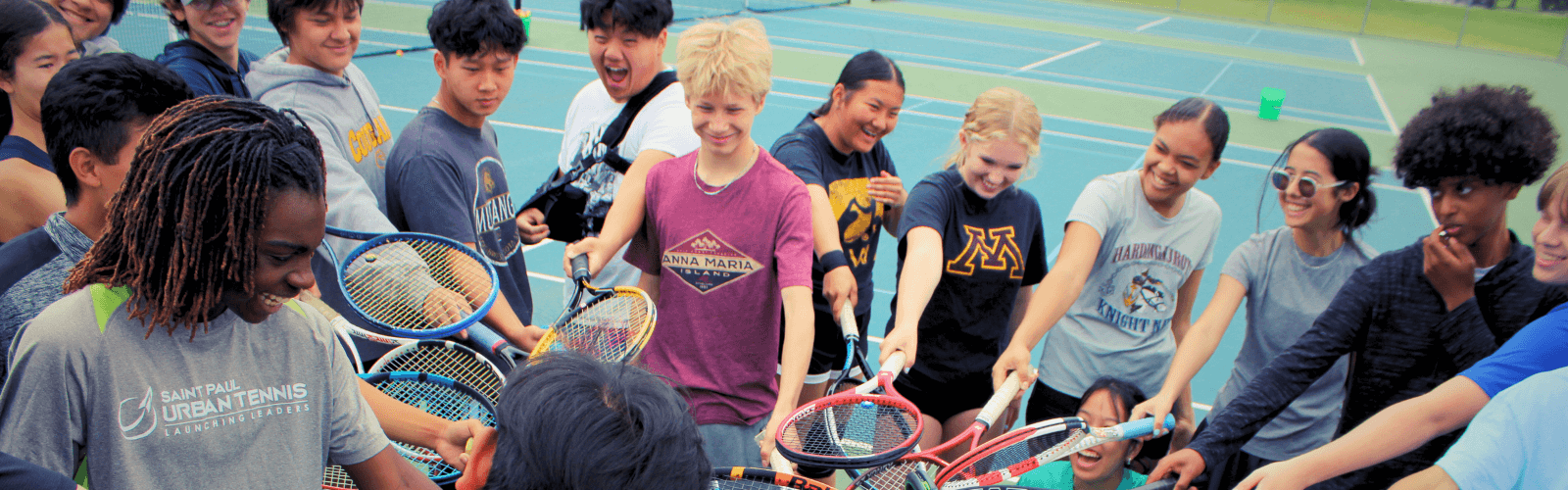 youth tennis coaches huddle