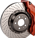 A close-up of a ventilated, cross-drilled performance brake disc with a red caliper on a black hub - Gold River Automotive