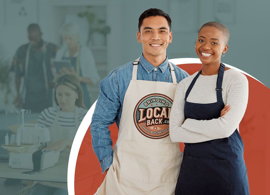 A man and a woman wearing aprons are standing next to each other.