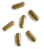 Six green-brown capsules scattered on a white surface.