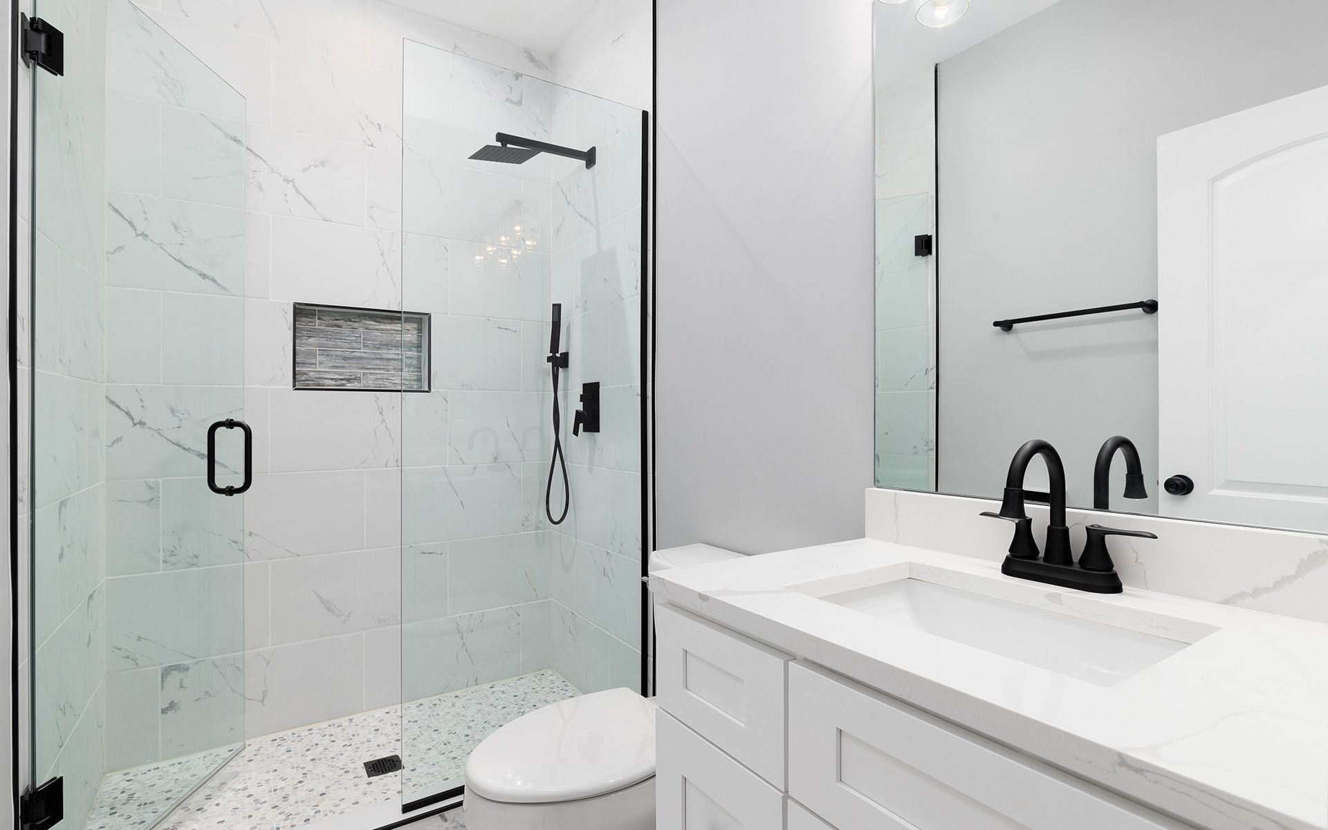 Modern home exterior with pool and backyard lounge area.