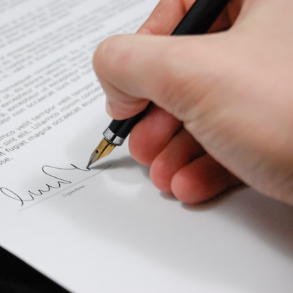 Attorney's Hand signing a legal document