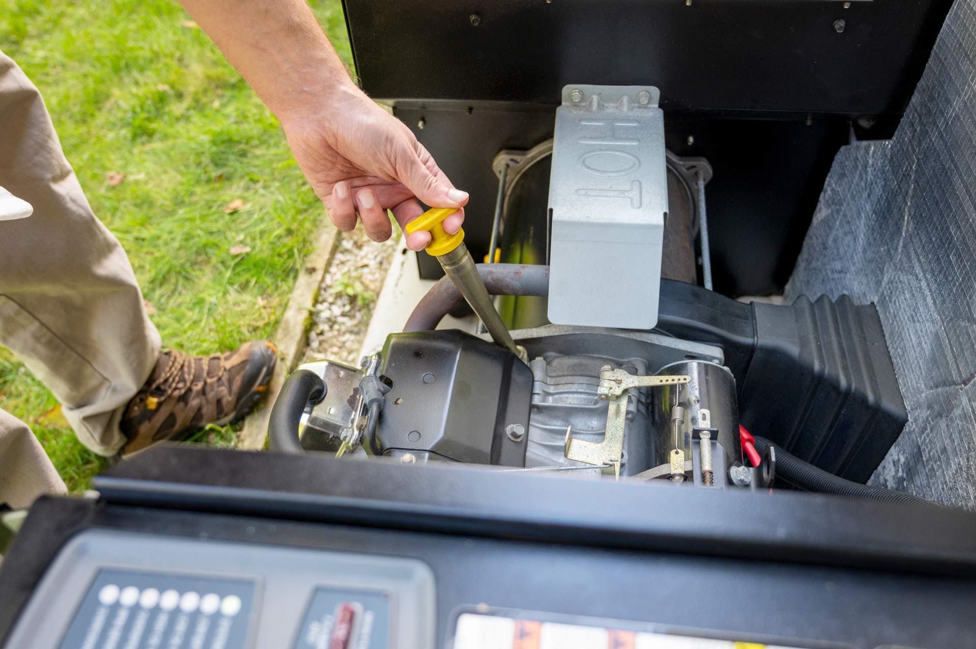 A man is fixing a generator