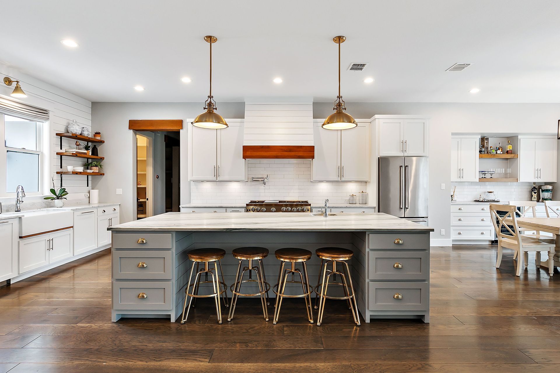 A large kitchen with a large island and stools