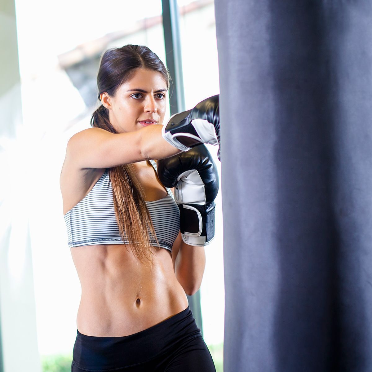 a girl practicing fitness kickboxing