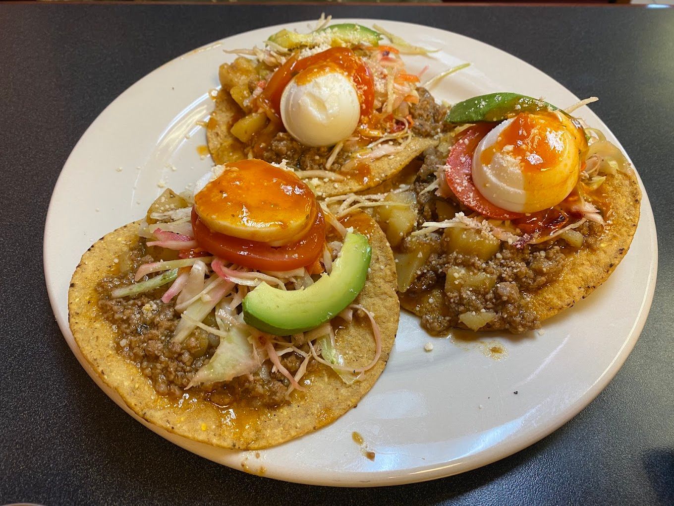 A plate of food with avocado and eggs on it Antonios Coney Island Ypsilanti MI