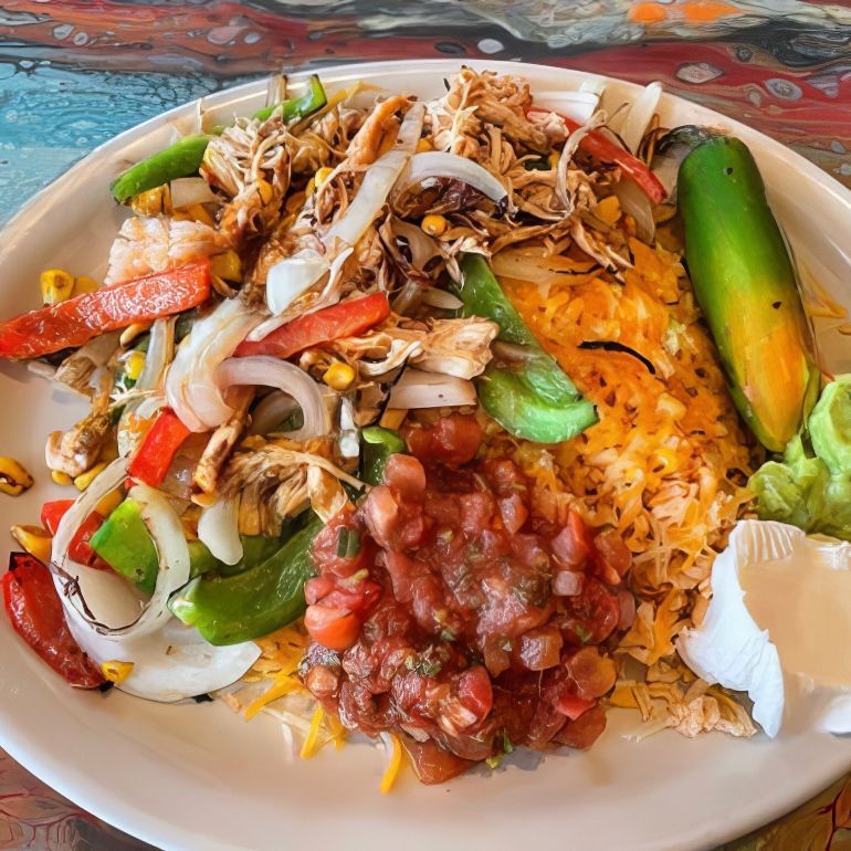 A close up of a plate of mexican food on a table. Bandito's Fresh Mexican Grill Ann Arbor MI