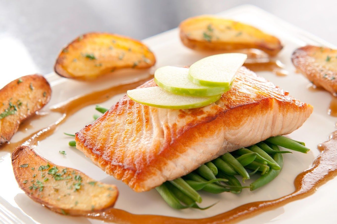 A white plate topped with fish green beans and salmon and potatoes Black Pearl Restaurant Ann Arbor