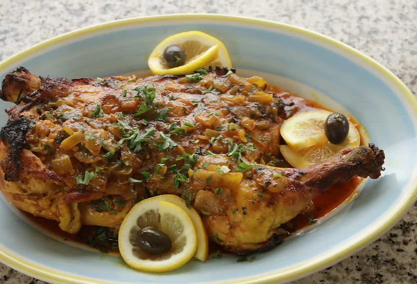 A plate of food with lemon slices and olives on it Casablanca restaurant Ypsilanti MI