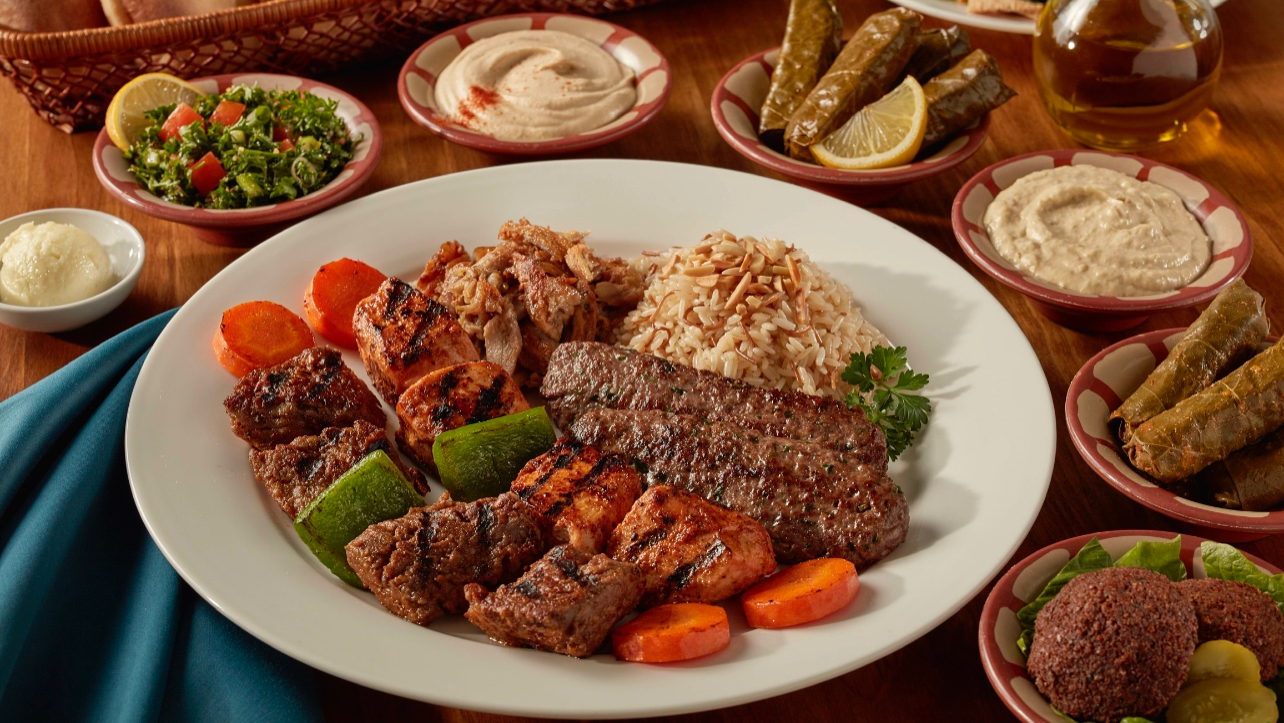 A plate of food with meat and vegetables on a table Palm Palace Restaurant Ann Arbor MI