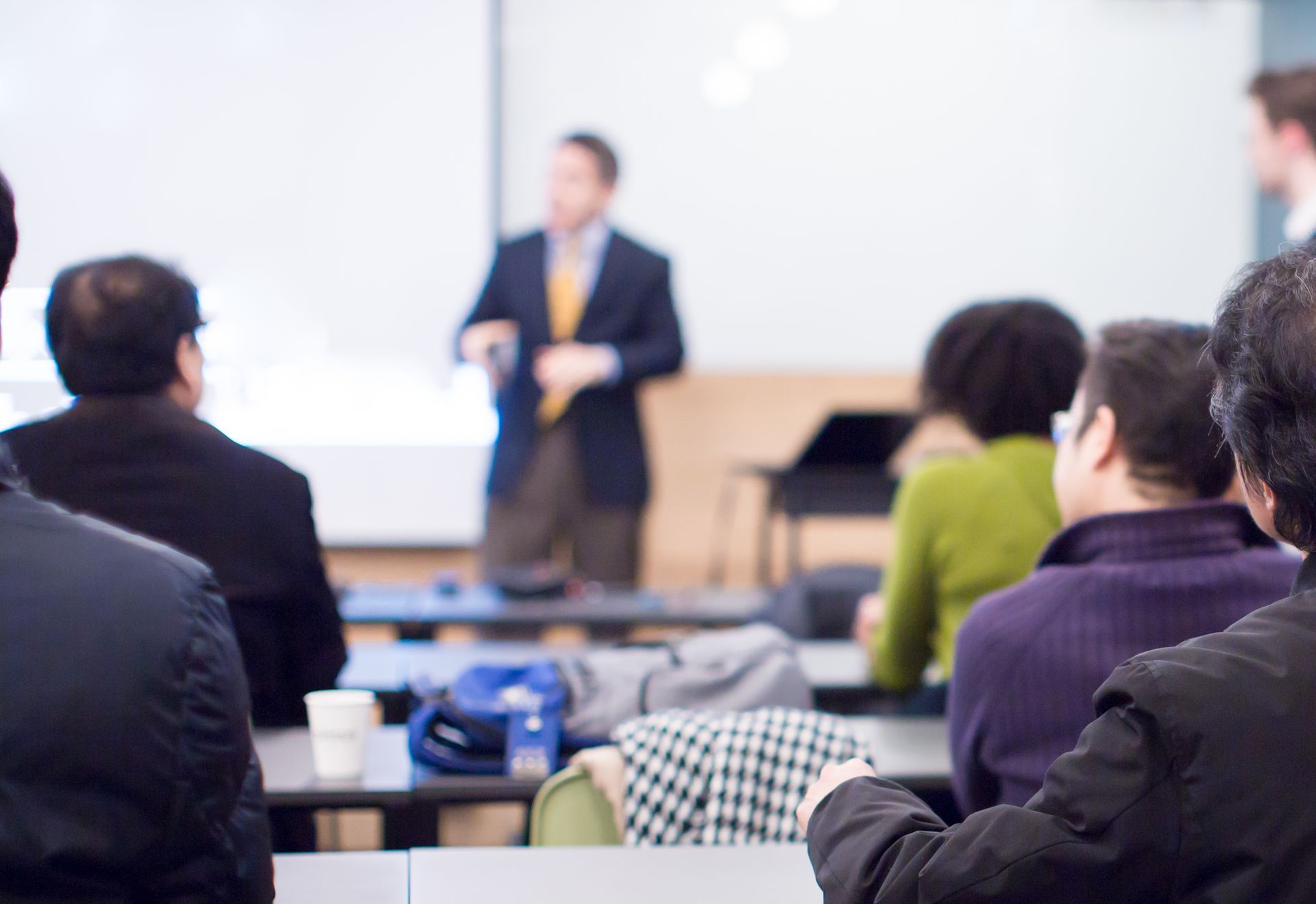 Adults attending an in-person real estate class 