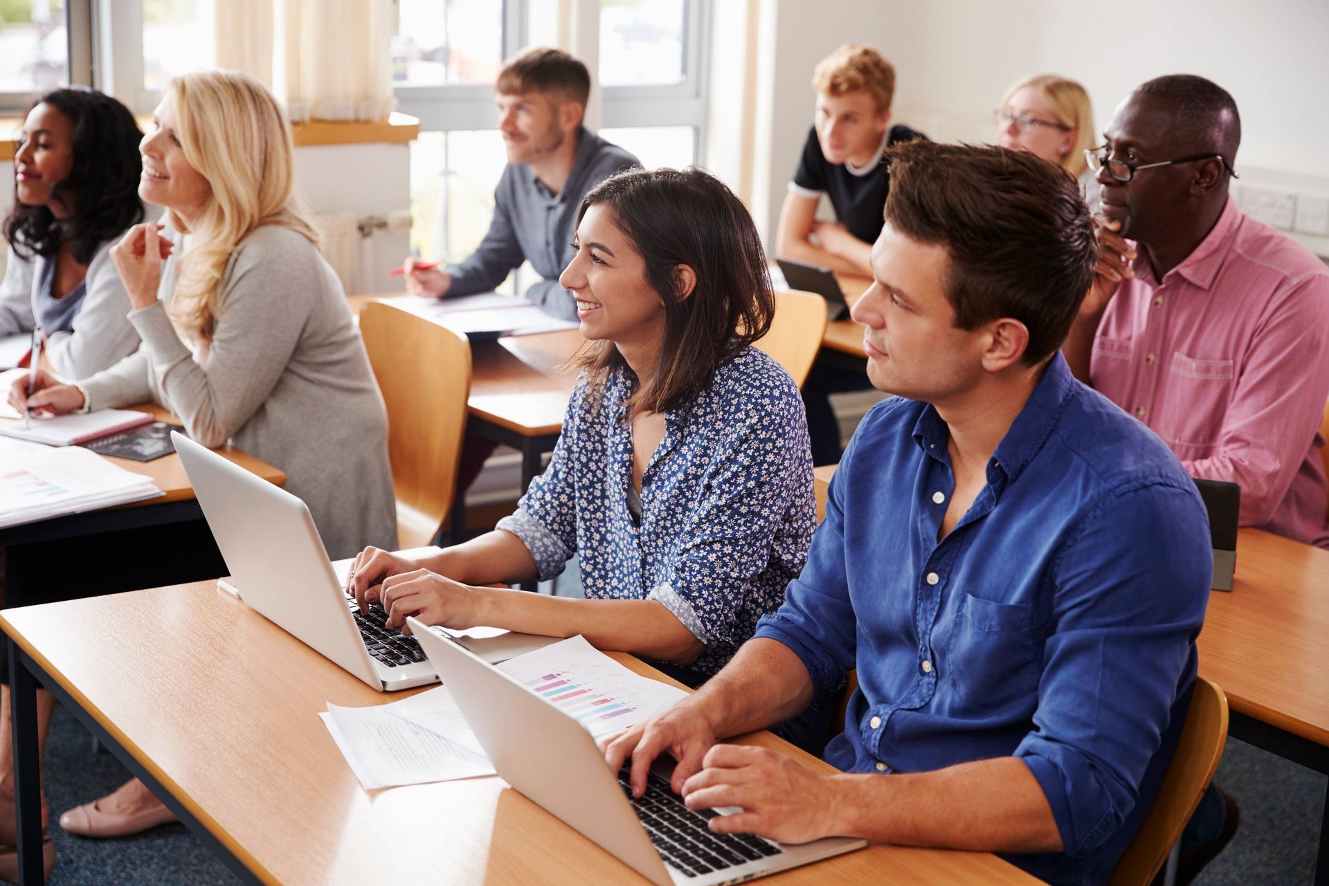 Professionals taking a continuing education course on real estate law at HomeServices Real Estate Ac