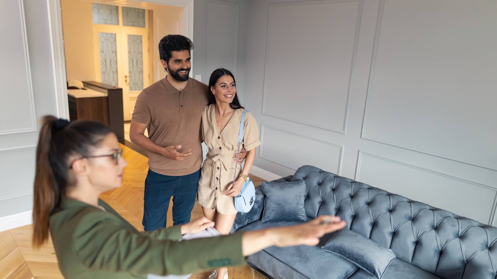 People touring a new home with a real estate salesperson at HomeServices Real Estate Academy near Le