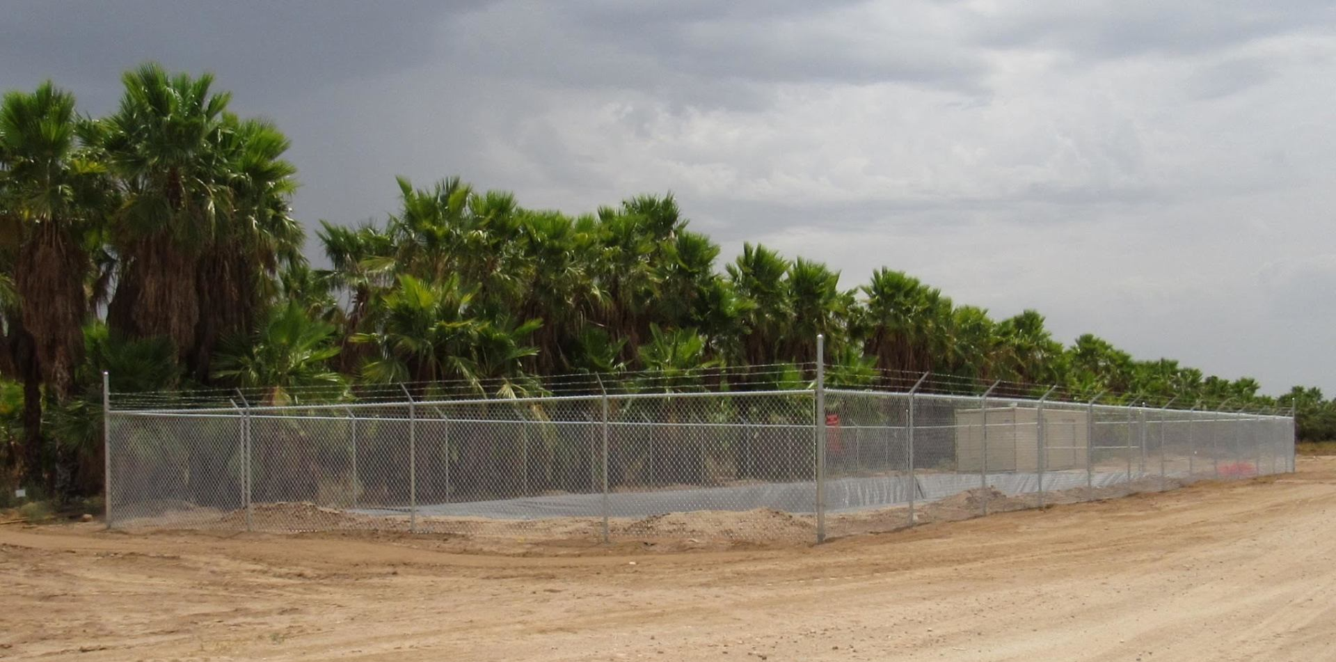 Chain link with barb wire installed at Moon Valley Nursery in Arizona