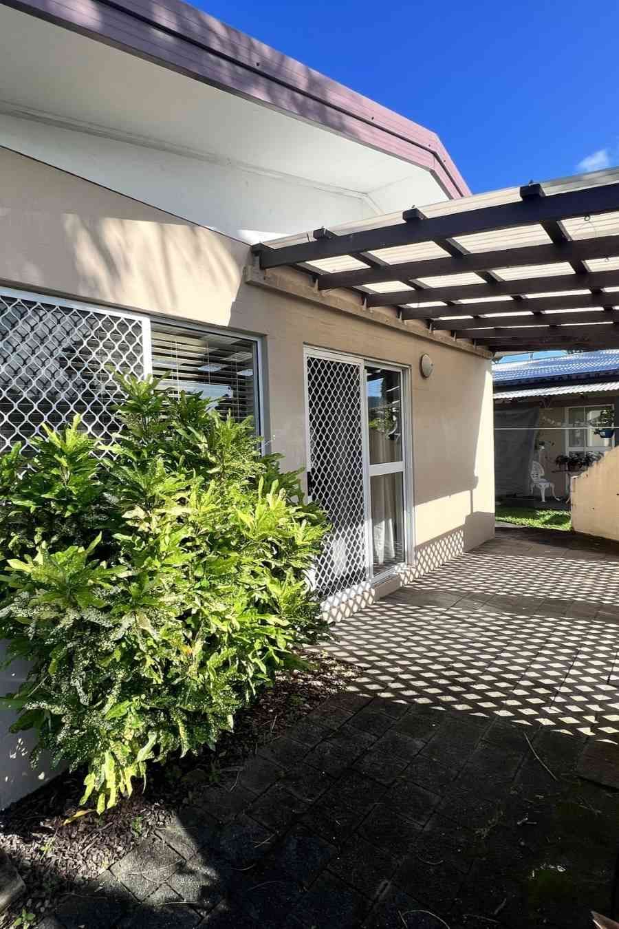 A House With A Pergola And A Sliding Glass Door — Rental Revolution In Manoora, QLD