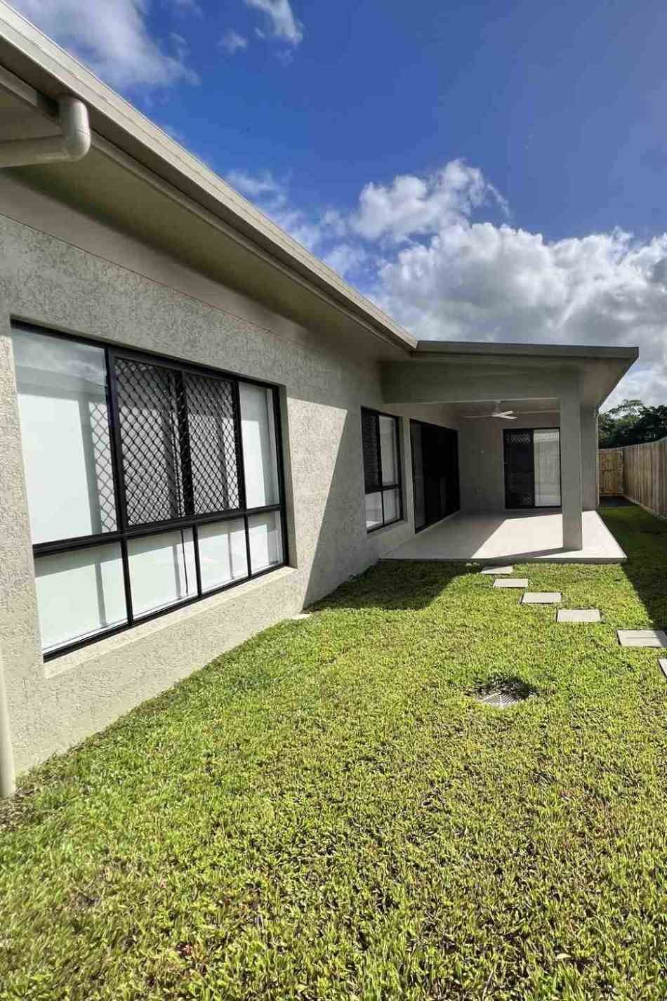 There Is A Large Island In The Middle Of The Kitchen — Rental Revolution In Manoora, QLD