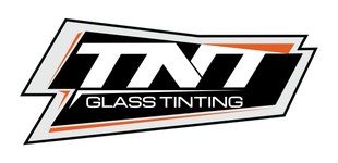 Logo for TNT Glass Tinting, featuring the white text "TNT" above "GLASS TINTING" on a black, orange, and grey background.
