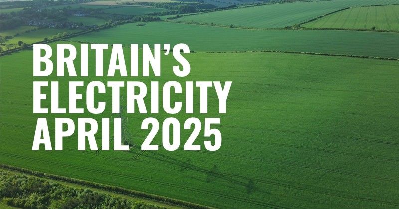 Green field with electricity pylon and text 