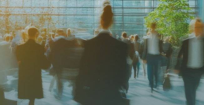 Business people walking around outside corporate buildings