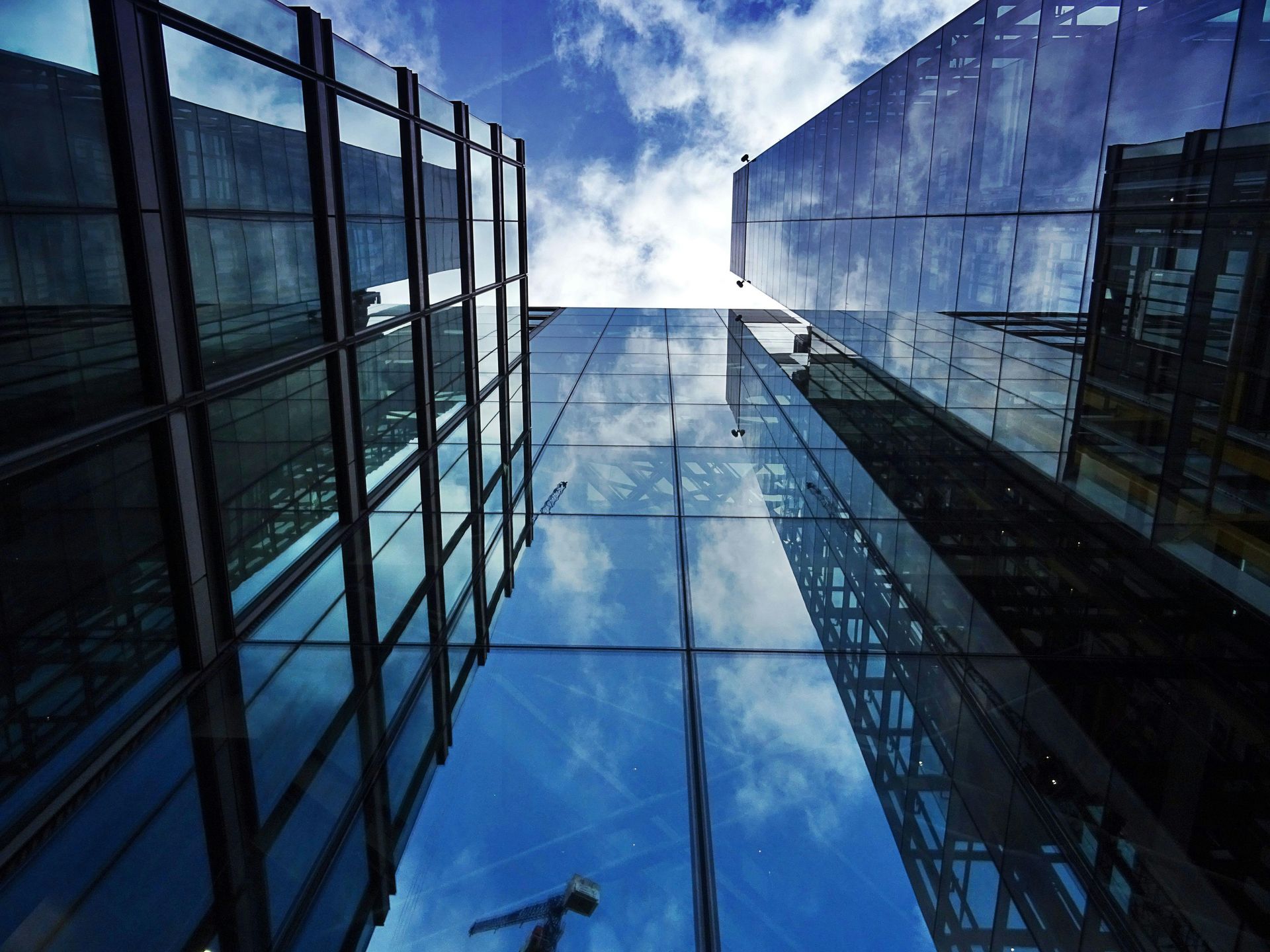 Glass office building, looking up at the sky