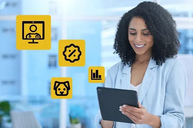 Um profissional sorridente usando um tablet com ícones amarelos representando consulta médica, desconto, um cachorro e dados.