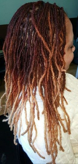 Woman with brown locs featuring ombre dye.