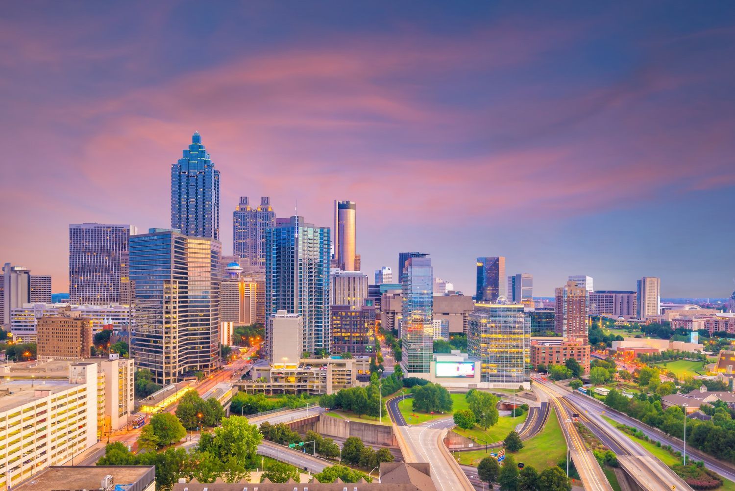 An aerial view of the city skyline at sunset.