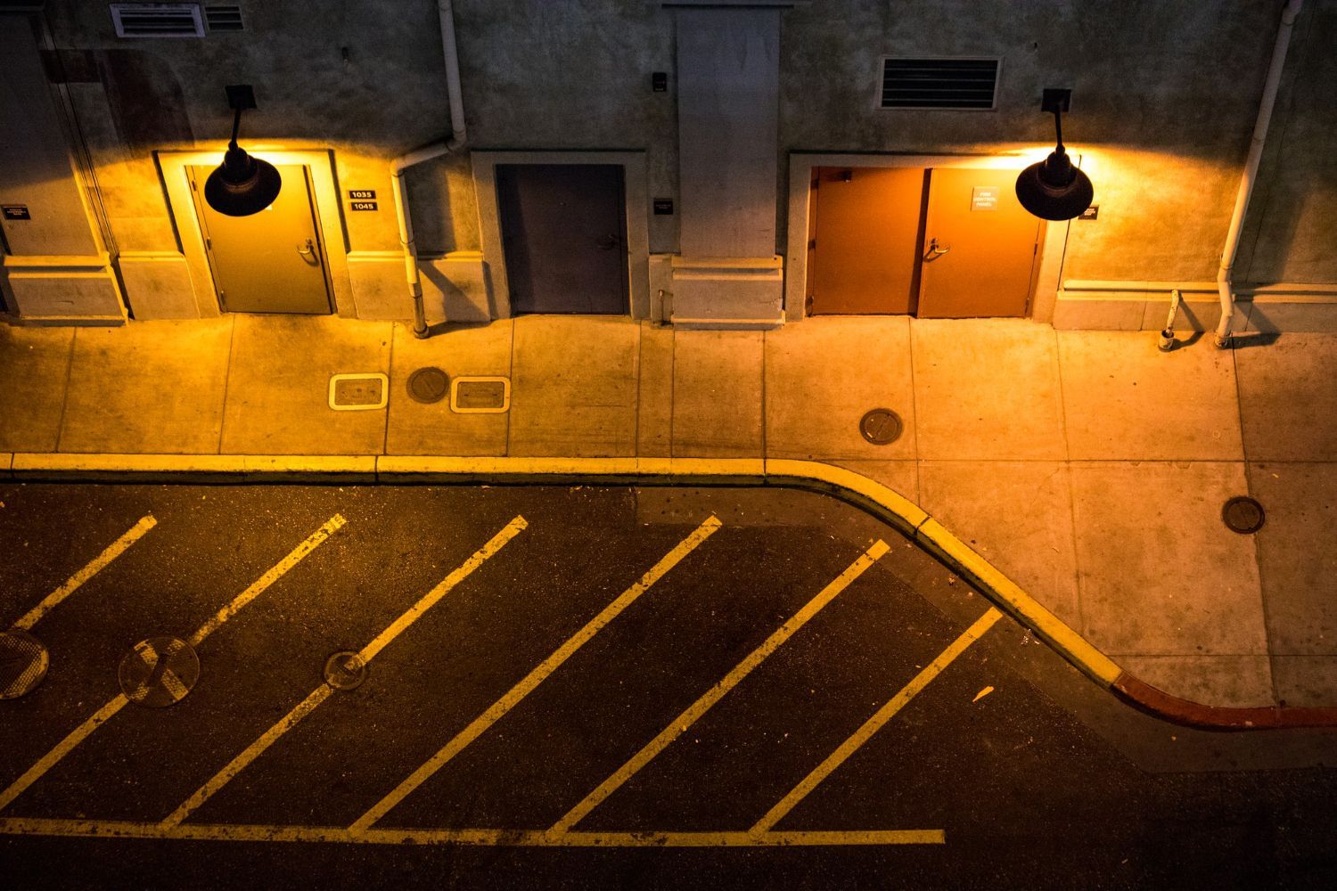 An aerial view of a parking lot at night