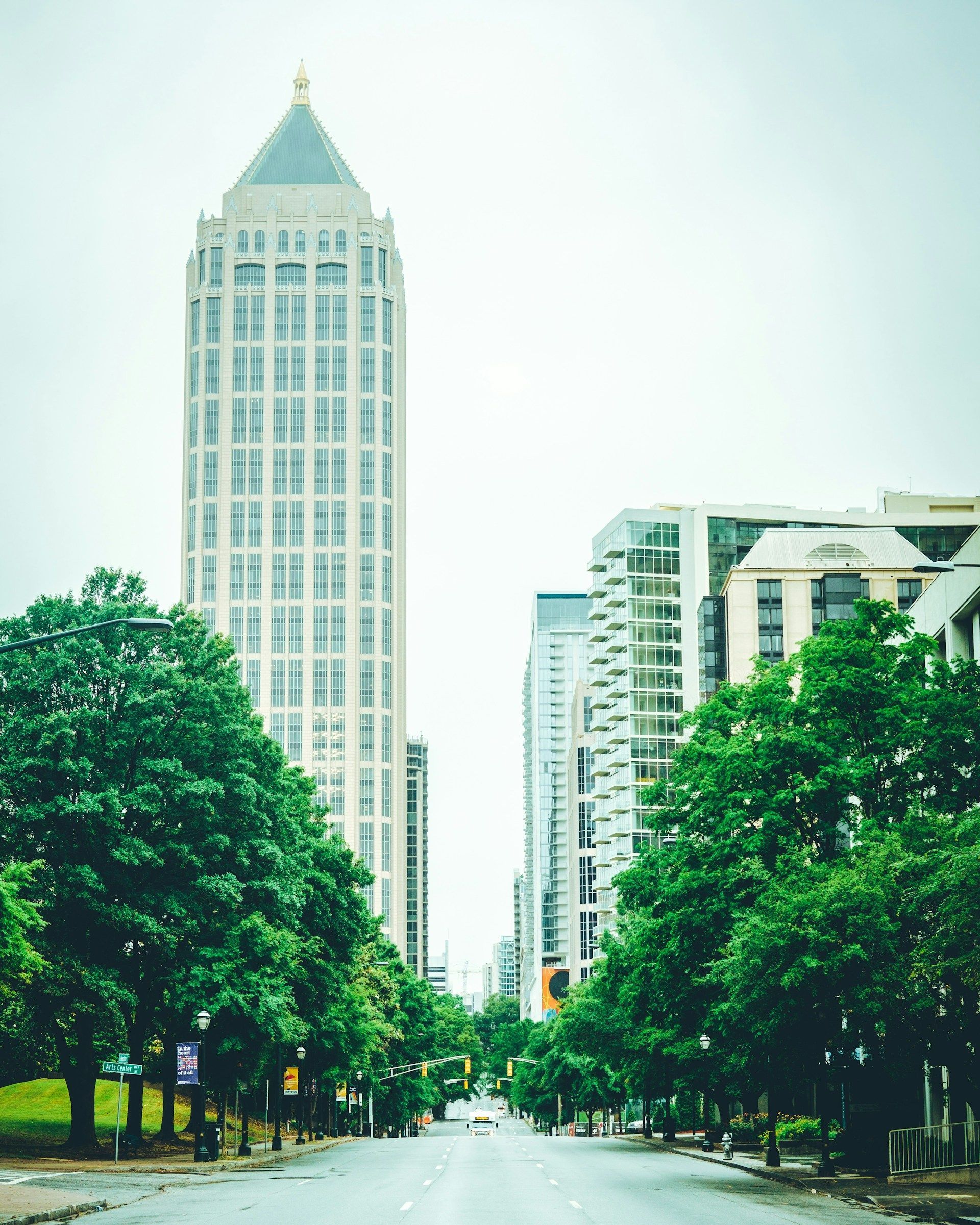 A city street with a tall building in the background