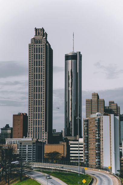A city skyline with a highway in the foreground