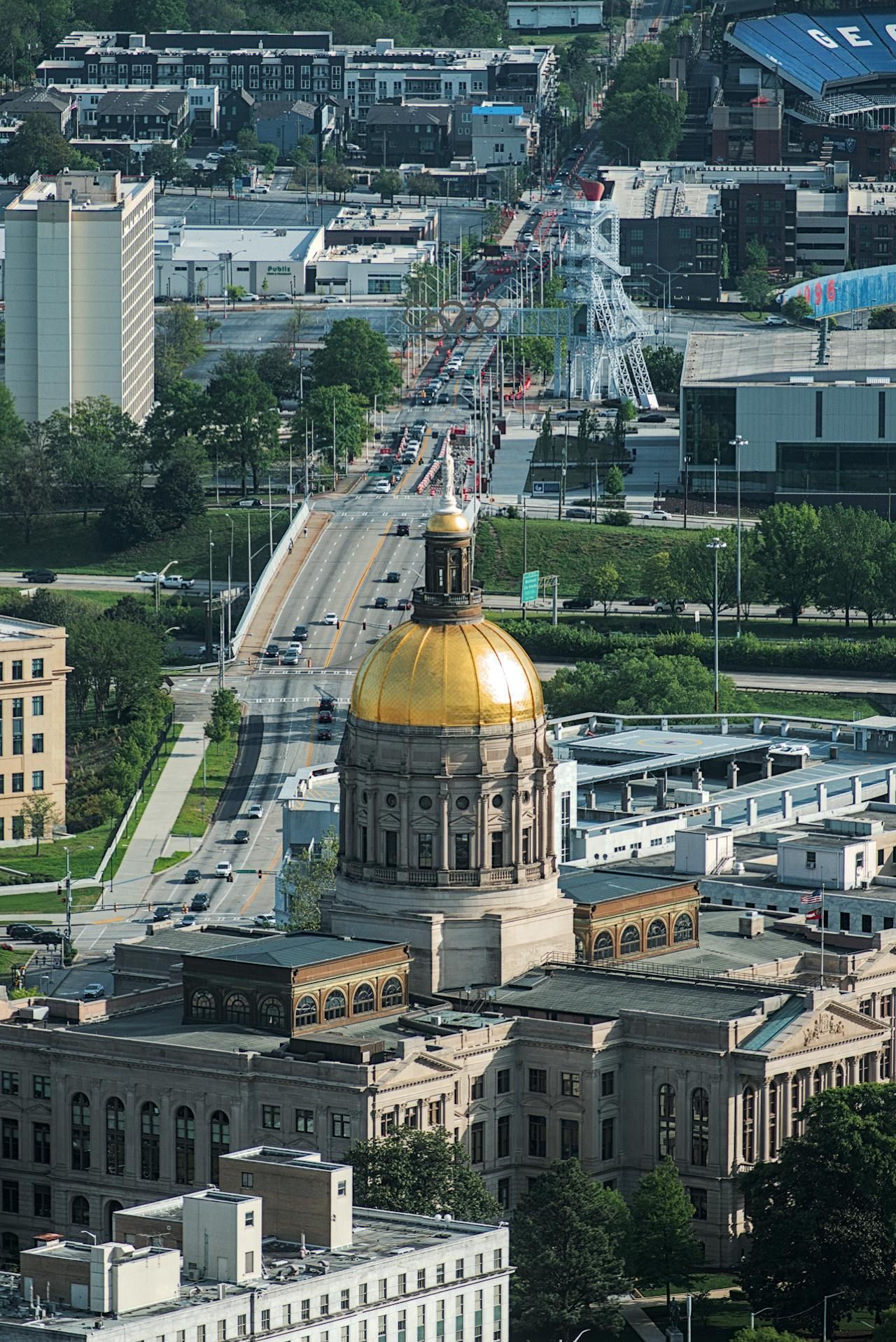 An aerial view of a city with a dome on top of a building