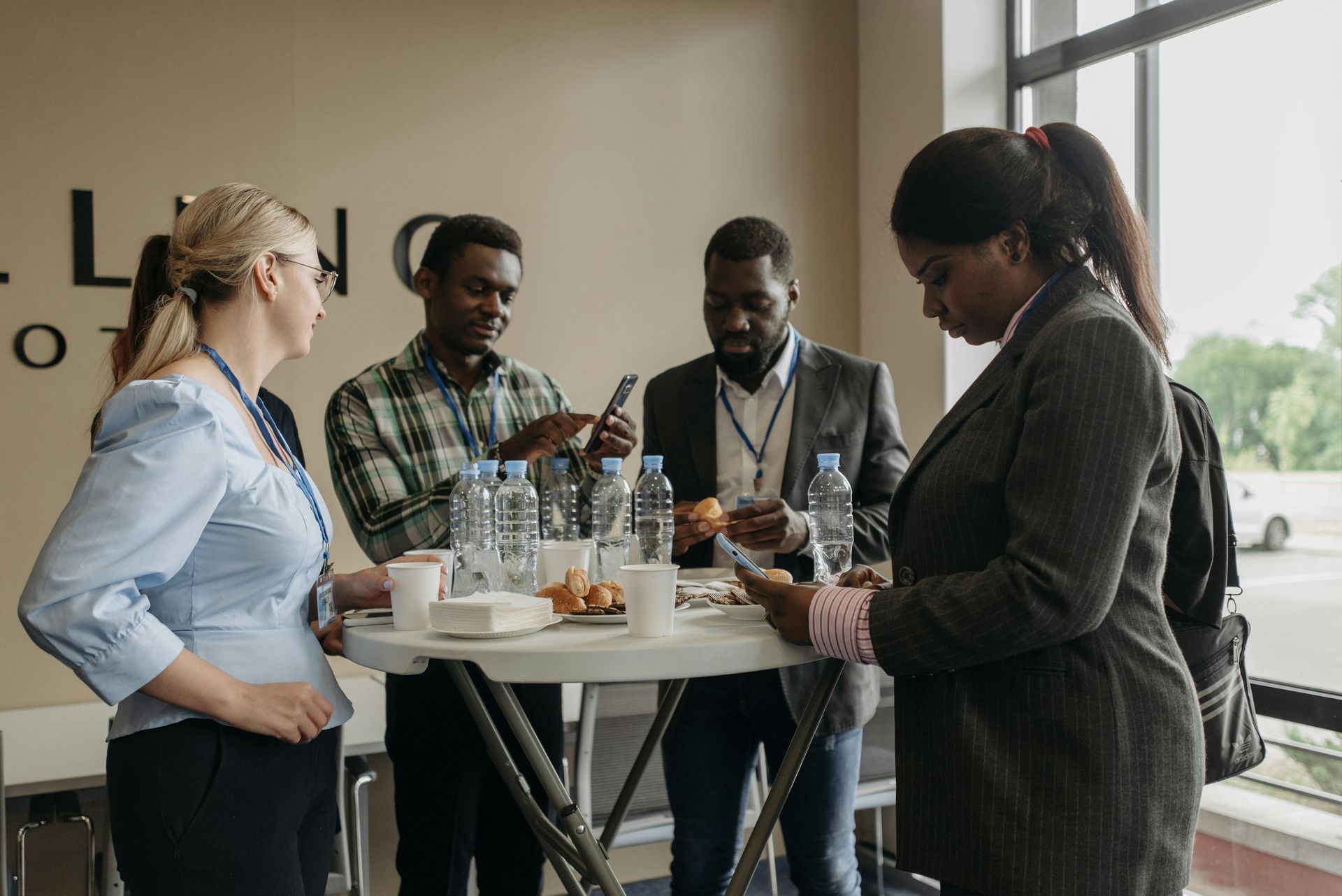 Interior of a diner with vintage signs, gas pumps, and a checkered floor. Dim lighting, red and gold accents.
