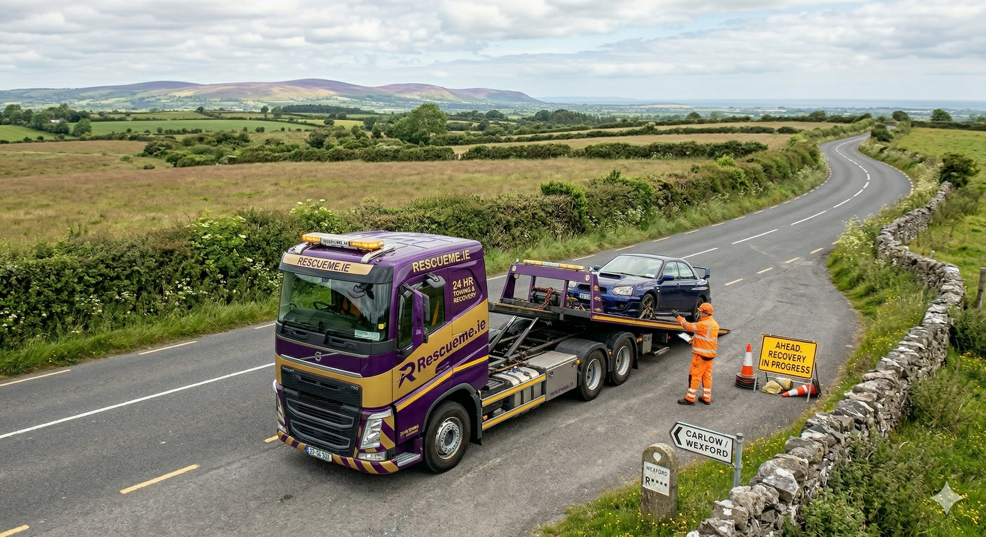Tow truck assisting broken down car on R733 Wexford between New Ross and Ballyhack